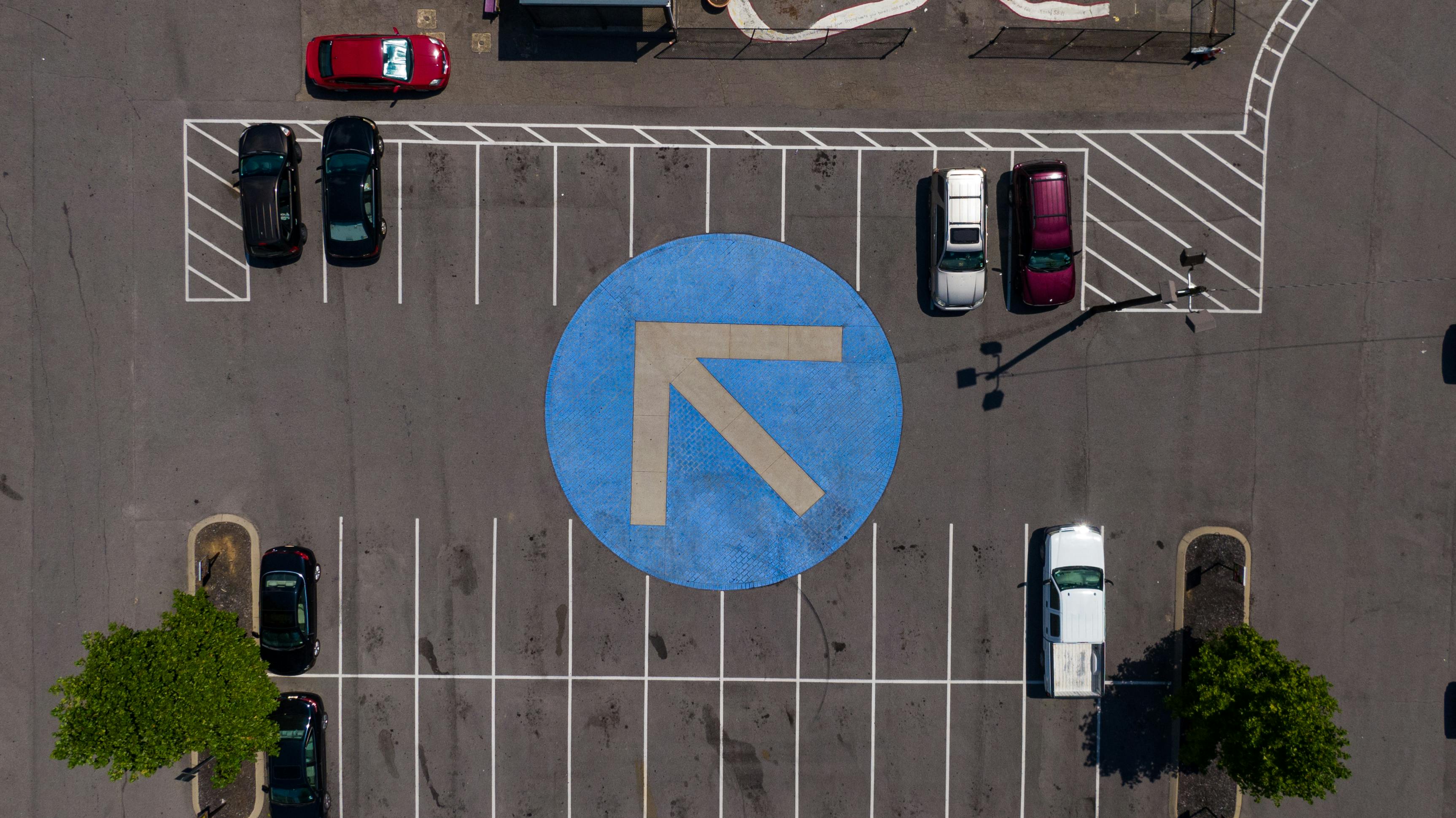 Parking lot with vehicles using AI enforcement